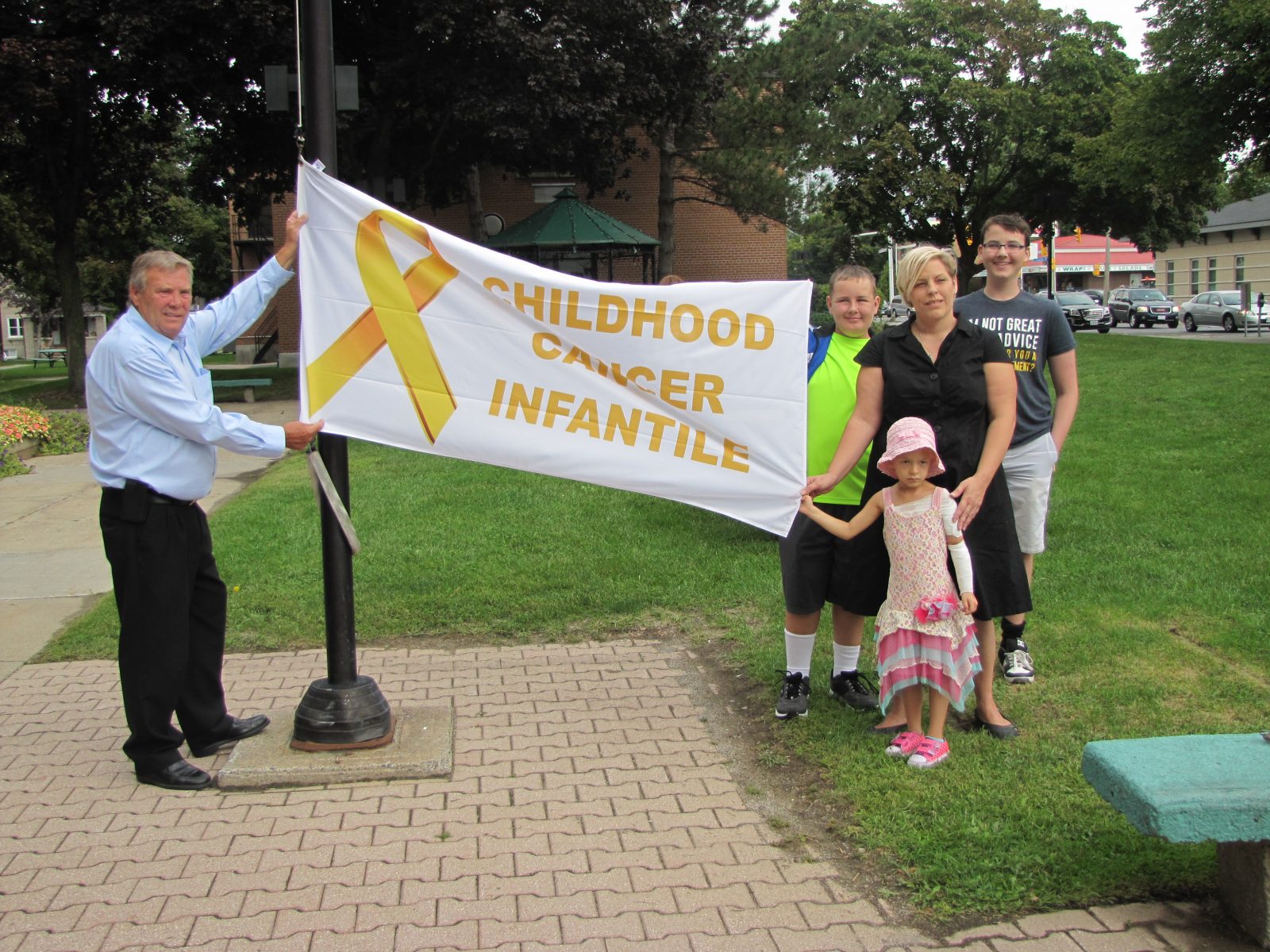 Flag raised to kickoff Child Cancer Awareness Month