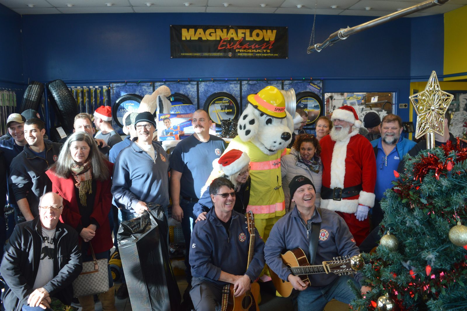 Sparky’s crew serenades Toy Drive supporters