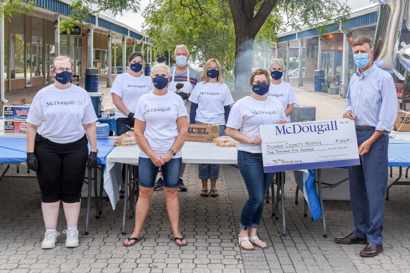 Celebrating 75 years of McDougall Insurance with a donation to DCH